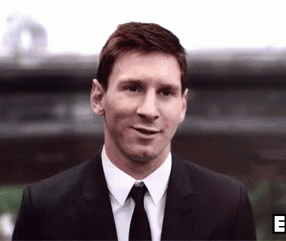 Smiling Man in Suit and Tie Outside Building