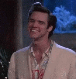 Smiling Man In Suit By Fish Tank GIF