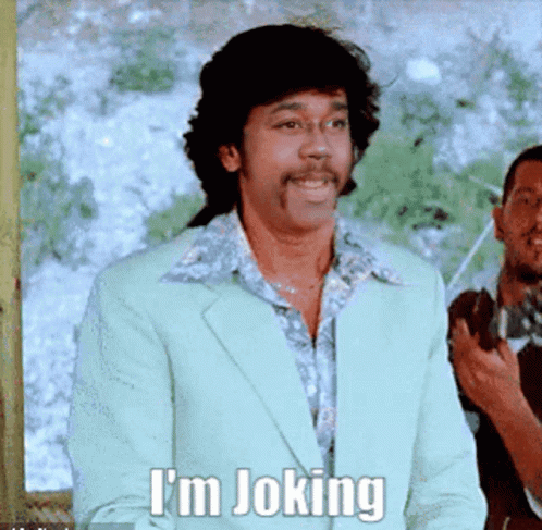 Smiling Man in Suit Says I'm Joking