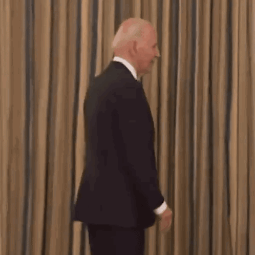 Smiling Man in Suit Tie Striped Curtain
