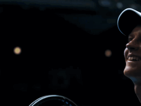 Smiling Man In White Hat Looking Up GIF