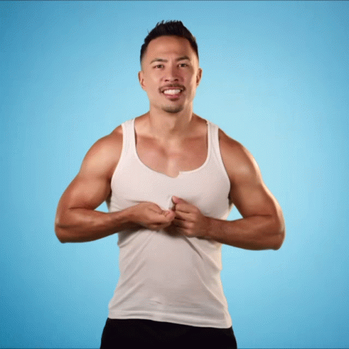 Smiling Man in White Tank Top