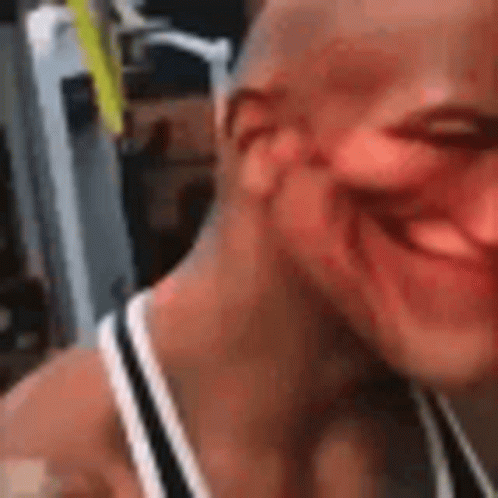 Smiling Man Making Funny Face in Tank Top