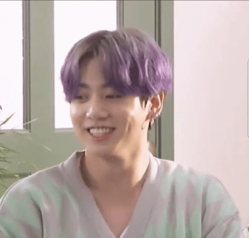 Smiling Man Purple Hair Green White Striped Shirt