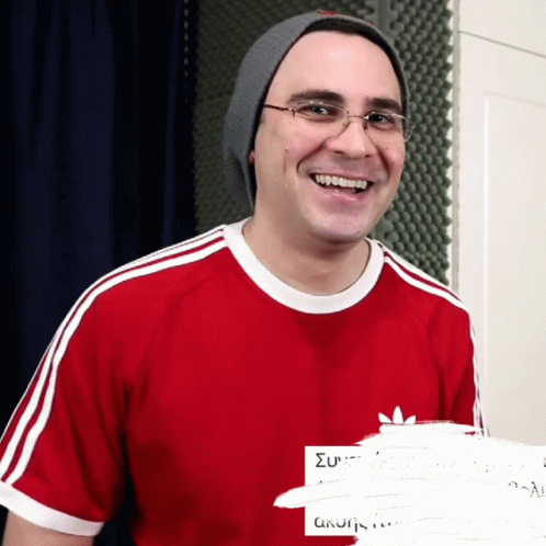 Smiling Man Red Adidas Shirt Gray Beanie