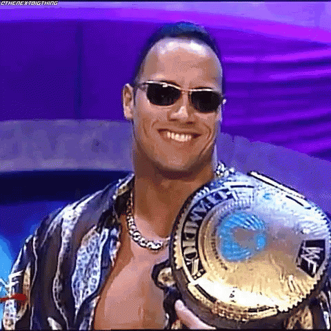 Smiling Man Wearing Sunglasses And Championship Belt GIF