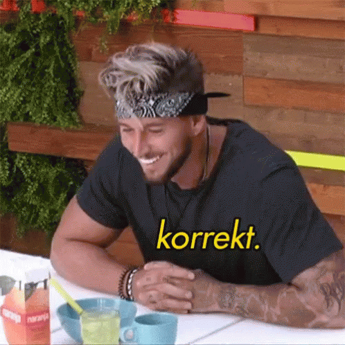 Smiling Man With Bandana And Korrekt Shirt GIF