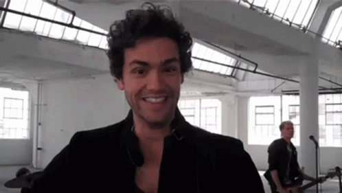 Smiling Man With F On Shirt Black And White GIF