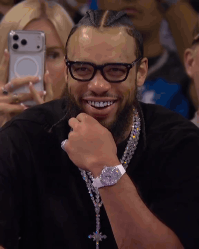 Smiling Man with Glasses and Diamond Necklace