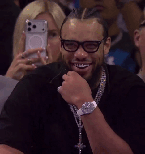 Smiling Man with Glasses and Watch