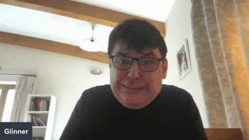 Smiling Man With Glasses At Glinner Sign GIF