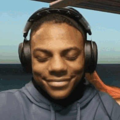 Smiling Man with Headphones and Sunglasses