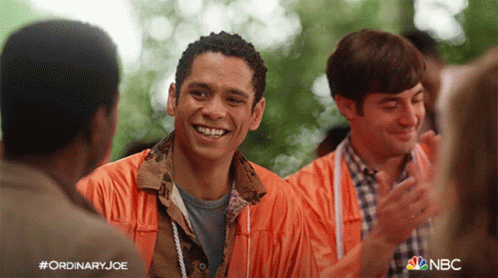 Smiling Orange Jacket Man Another in NBC Ad