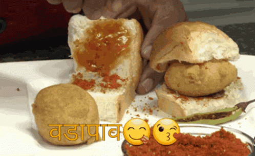 Smiling Person Holding Sandwich With Sauce GIF
