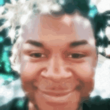 Smiling Person's Blurry Face