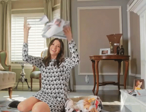 Smiling Then Throwing Papers GIF
