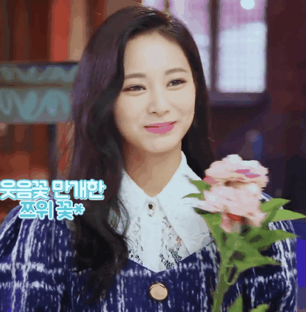 Smiling Tzuyu Holding Flowers GIF