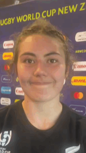 Smiling Woman by Rugby World Cup New Zealand Sign