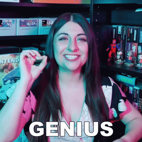 Smiling Woman Holding Small Object By Genius Shelf GIF