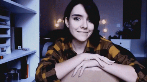 Smiling Woman in Plaid Shirt