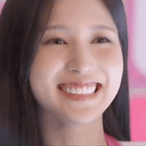 Smiling Woman Pink Background