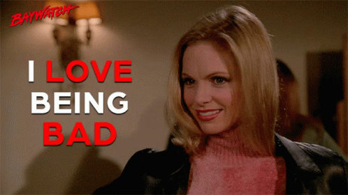 Smiling Woman Pink Sweater I Love Being Bad Sign