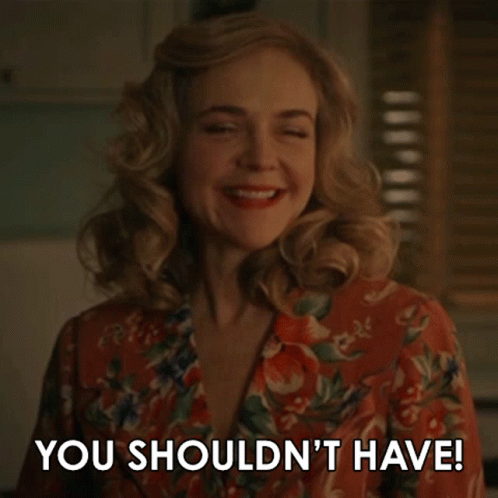 Smiling Woman Saying You Shouldn't Have
