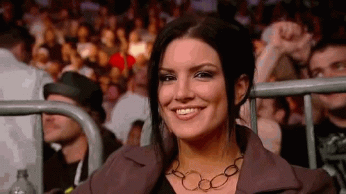Smiling Woman Sitting in Boxing Ring Stands