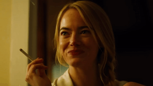 Smiling Woman Smoking Cigarette GIF