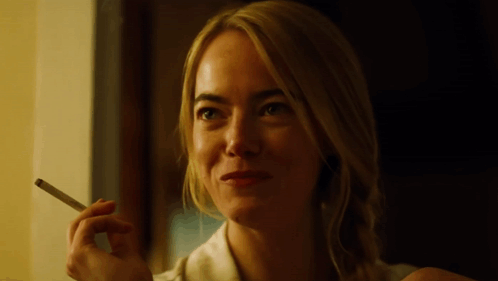 Smiling Woman Smoking Cigarette GIF