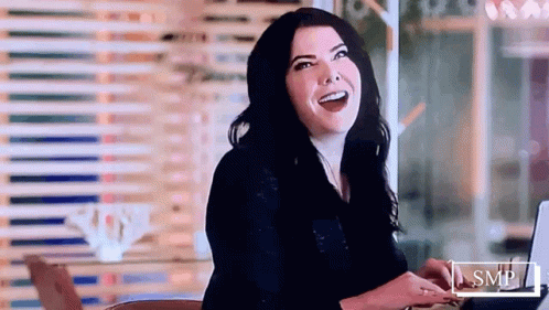Smiling Woman Using Laptop GIF