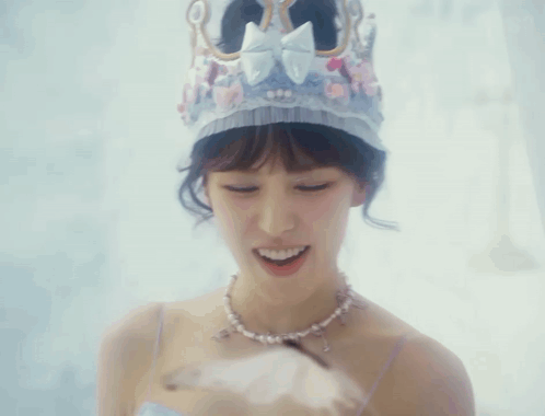 Smiling Woman With Crown and Necklace