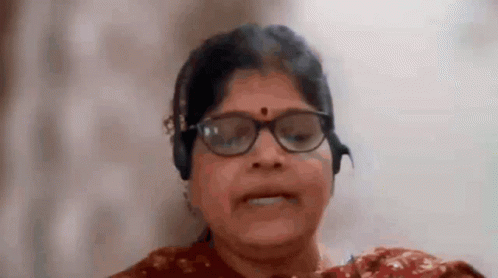 Smiling Woman With Glasses and Headphones
