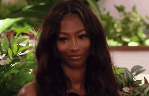Smiling Woman With Long Dark Hair And Nose Ring GIF