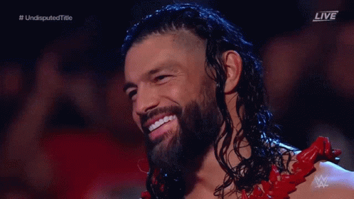 Smiling Wrestler With Long Hair And Beard GIF
