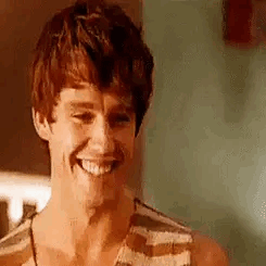 Smiling Young Man in Striped Tank Top