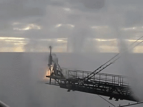 smoke is coming out of a machine with a flame coming out of the top