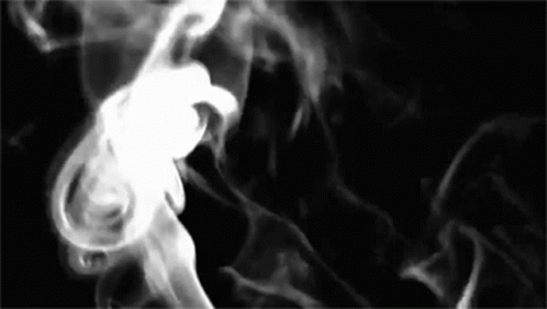 Smoke Is Coming Out Of A Pipe On A Black Background In A Black And White Photo . GIF