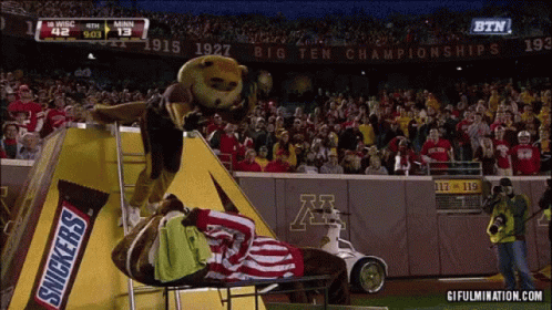 Snickers Bar as Mascot on Football Field