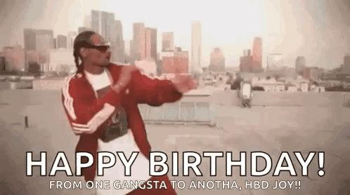 Snoop Dogg Is Dancing On A Rooftop In Front Of A City . GIF