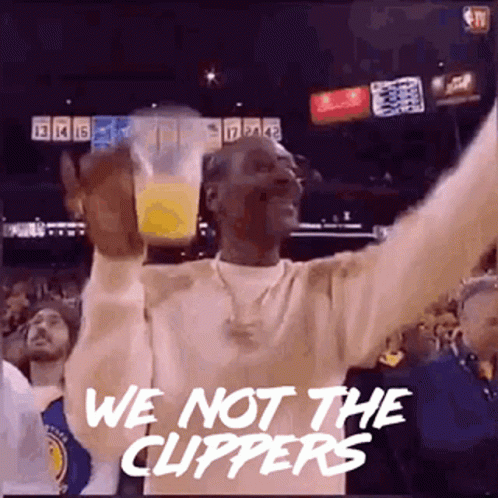Snoop Dogg Is Holding A Cup Of Orange Juice In His Hand And Says `` We 'Re Not The Clippers '' . GIF
