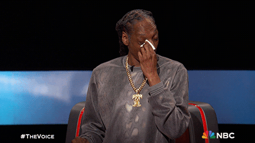 Snoop Dogg Is Sitting In Front Of A Screen That Says Nbc On It GIF