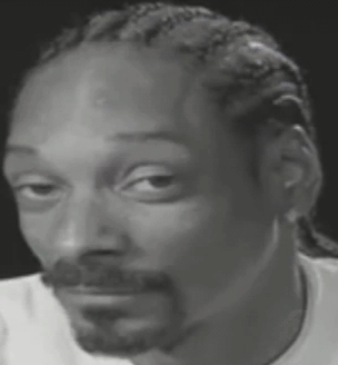 Snoop Dogg Is Wearing A White Shirt And Making A Funny Face . GIF