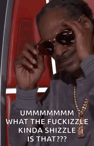 Snoop Dogg Is Wearing Sunglasses And A Necklace While Sitting In A Red Chair . GIF