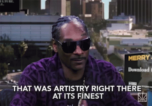 Snoop Dogg Is Wearing Sunglasses And A Purple Jacket And Says That Was Artistry Right There At Its Finest GIF