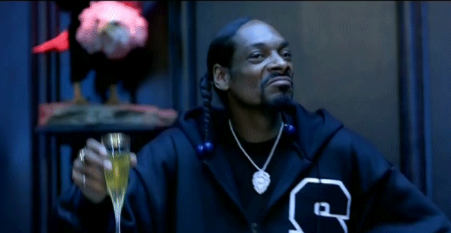 Snoop Dogg Raising Glass While Grooving GIF