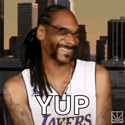 Snoop Dogg Smiling in Lakers Jersey with Glasses