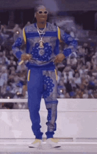 Snoop Dogg Standing on Stage with Microphone