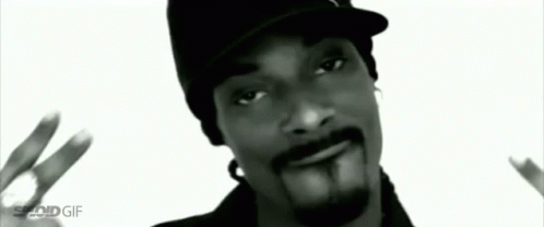Snoop Dogg Wearing Hat Giving Peace Sign