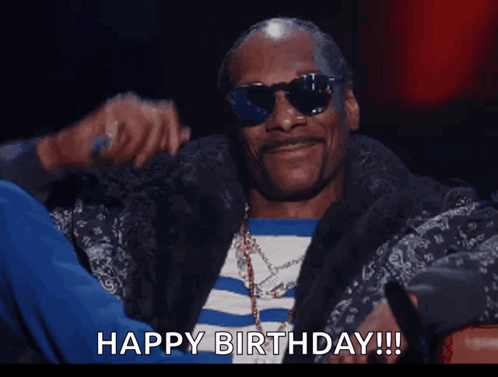 Snoop Dogg Wearing Sunglasses And A Ring Says Happy Birthday GIF